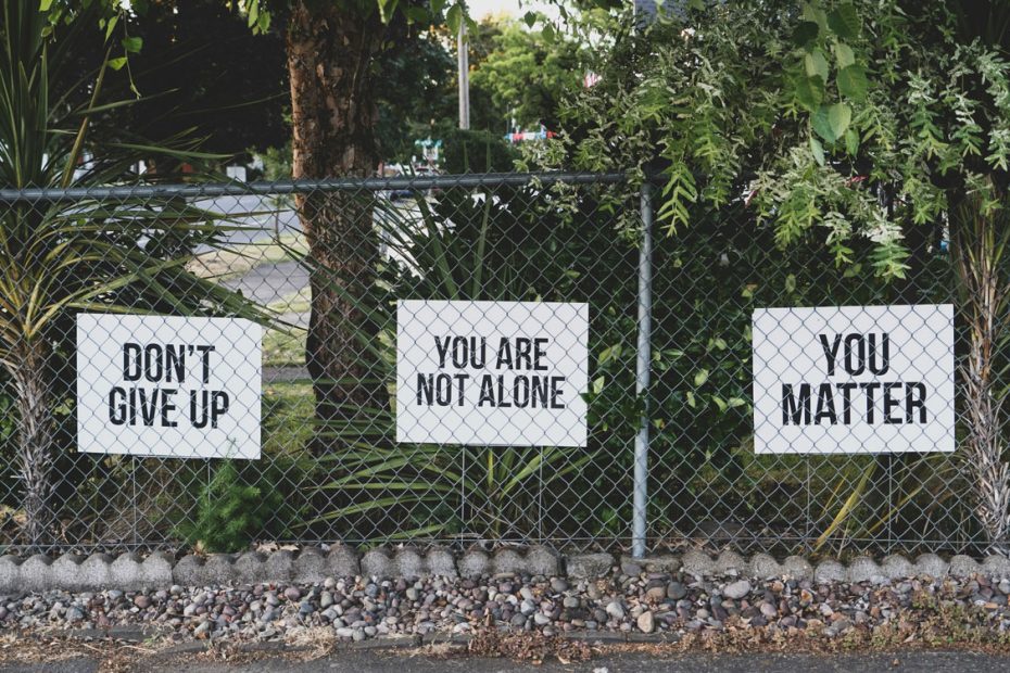 Green area with three positive message signs